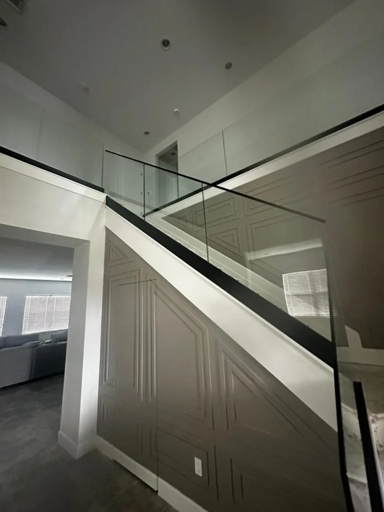 Contemporary Paneling and Glass Railing Transformation