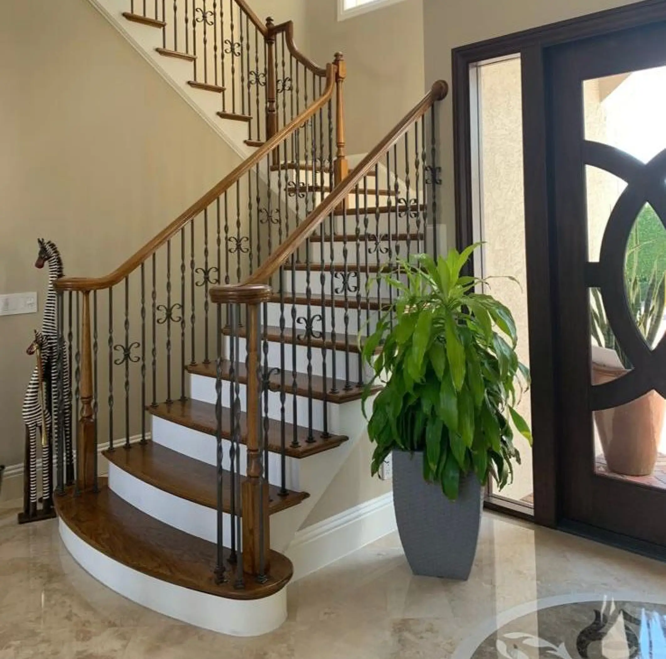 Wall paneling design laminate wood stairs with the square bull-nose tread and completed with glass railings